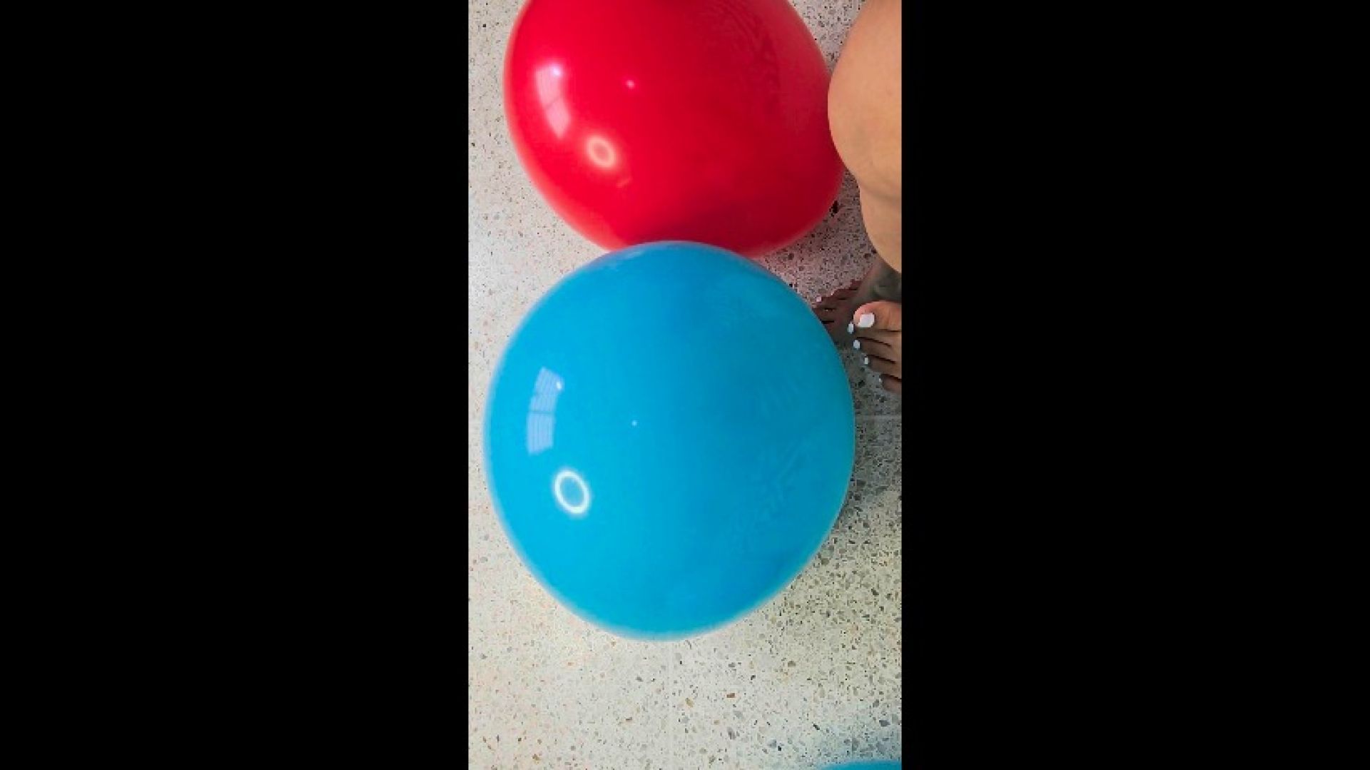 Creamy bare feet popping balloons