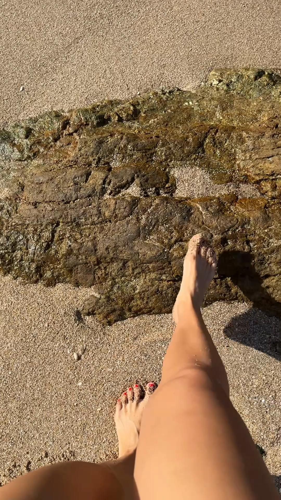 Barefoot walk by the ocean