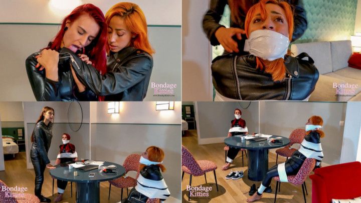 Two girls in leather bound and gagged