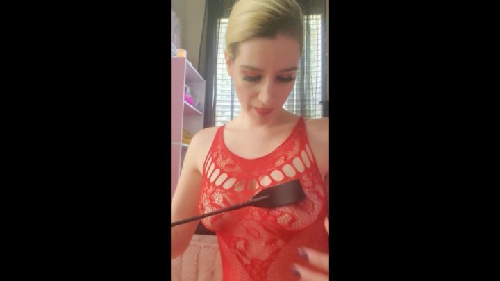 Crop and handcuffs mounting a dildo