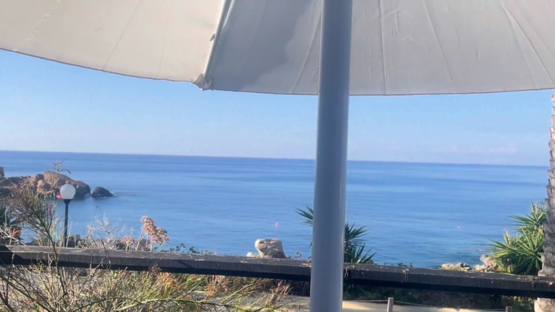 drinking a coffee on holiday by the sea