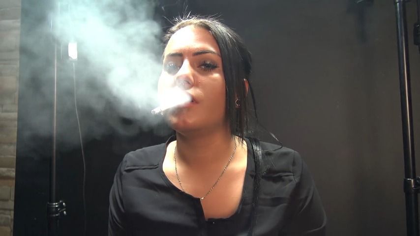 a cigarette dangling with Audrey