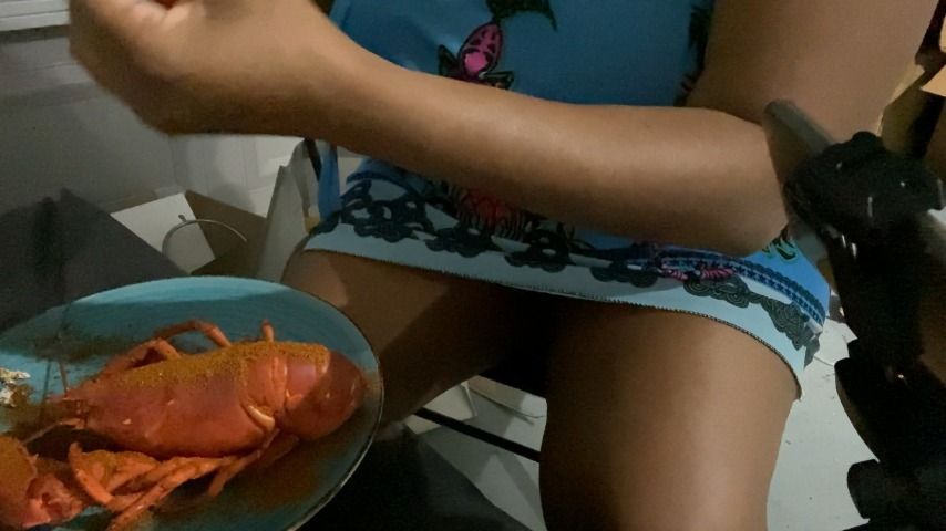 sitting and eating lobster