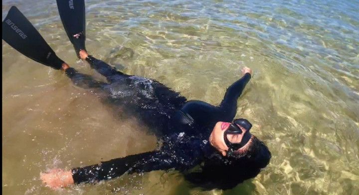 neoprene and snorkel gear in the sea