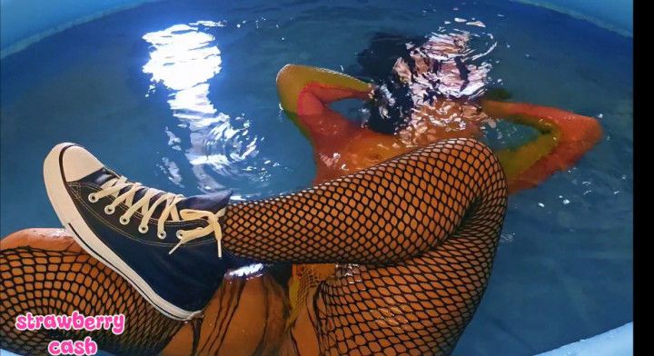 Underwater in fishnets and Converse