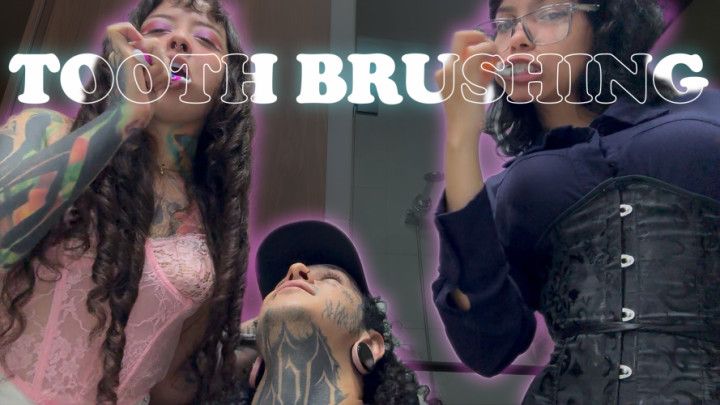 Two giantesses brush their teeth and spit out the tiny