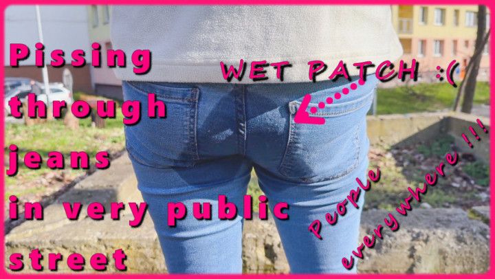 Pissing through jeans in very public street