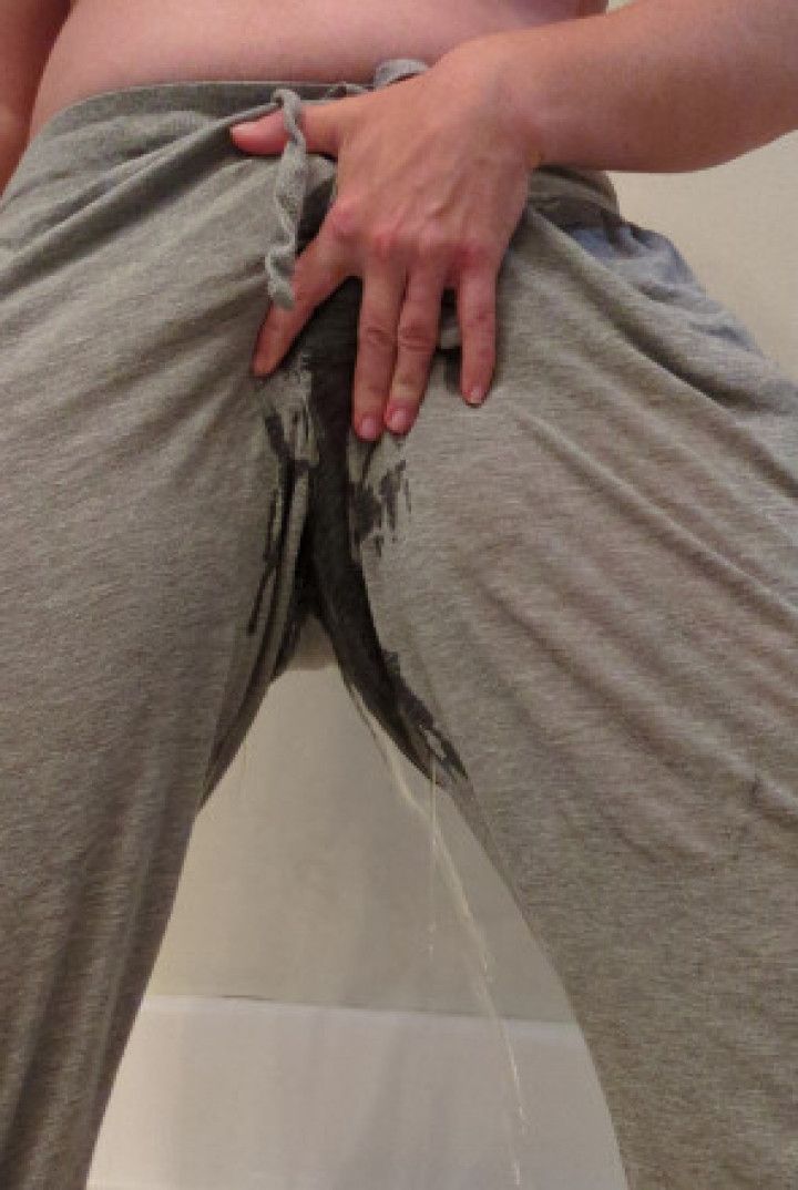 Wetting my sweat pants and showing my pussy
