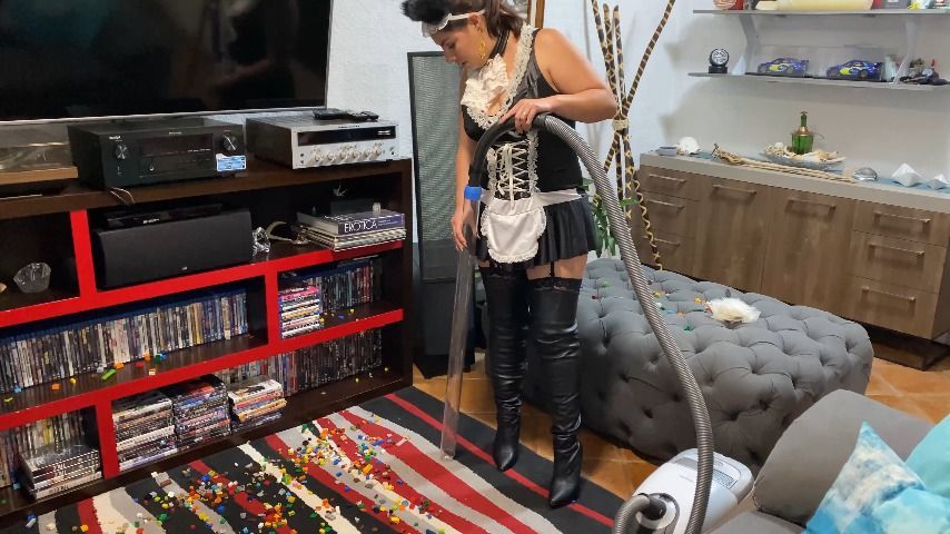 maid vacuuming legos with crystal tube