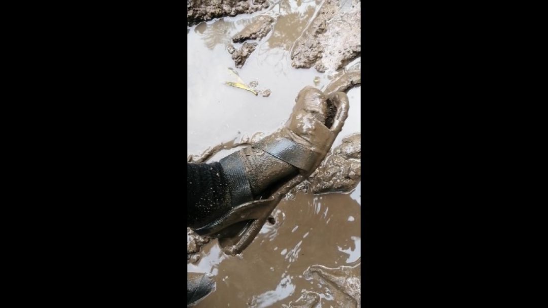 Muddy socks and sandles