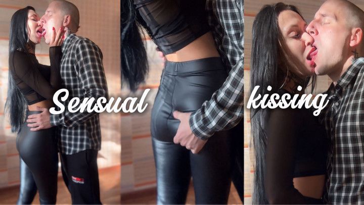 Hot kiss with a brunette in leather leggings