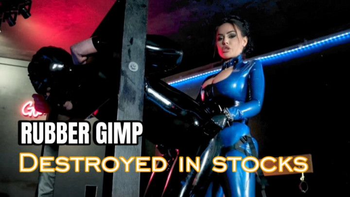 Rubber gimp destroyed in the stocks
