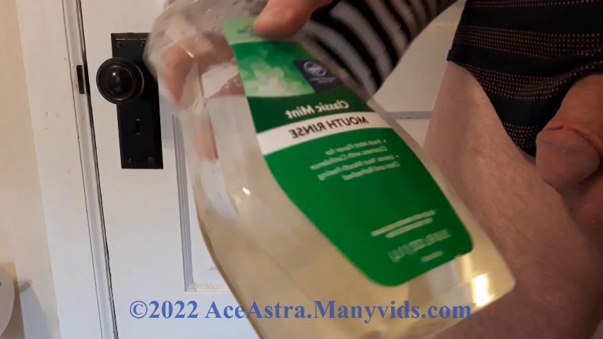 CD Femboy Peeing in Mouthwash Bottle