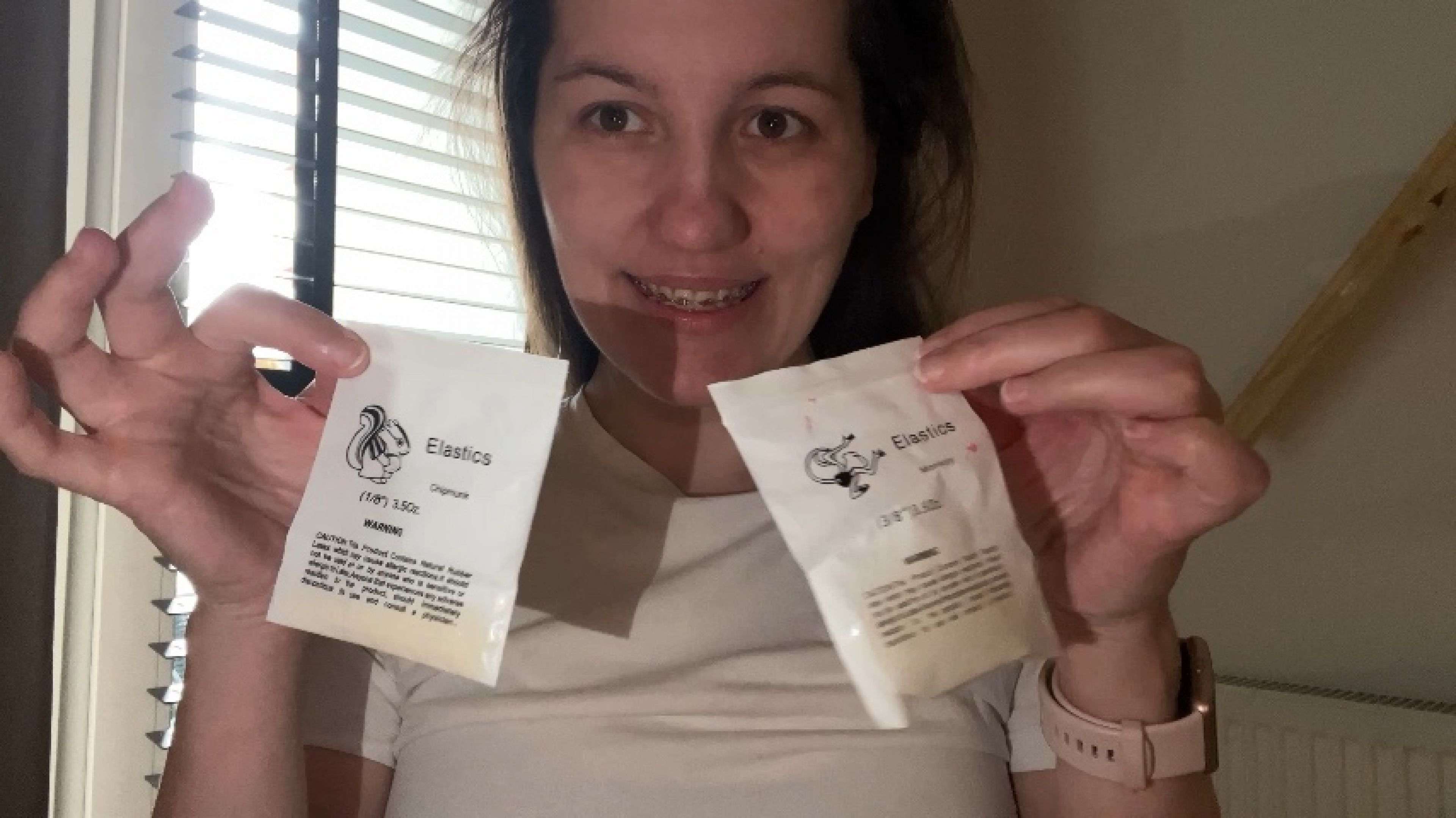 Putting rubber bands on your braces