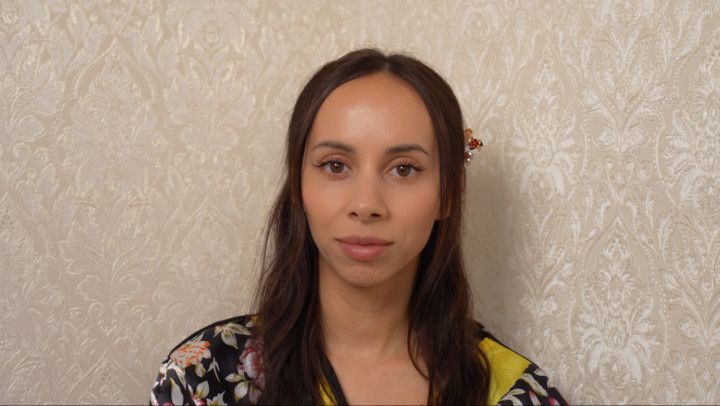 I'm looking at the camera in a geisha costume