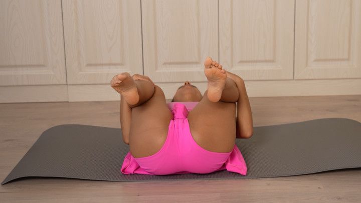 Dress yoga exercises in pink short skirt