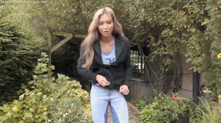 Natalia Forrest wets her jeans in the garden