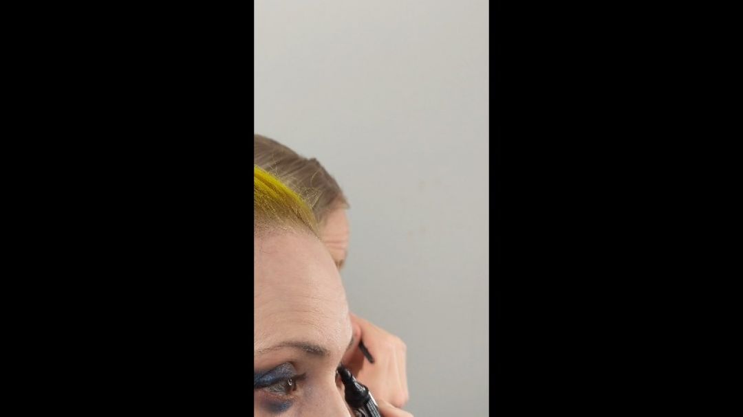 Crossdresser Doing Eyeliner