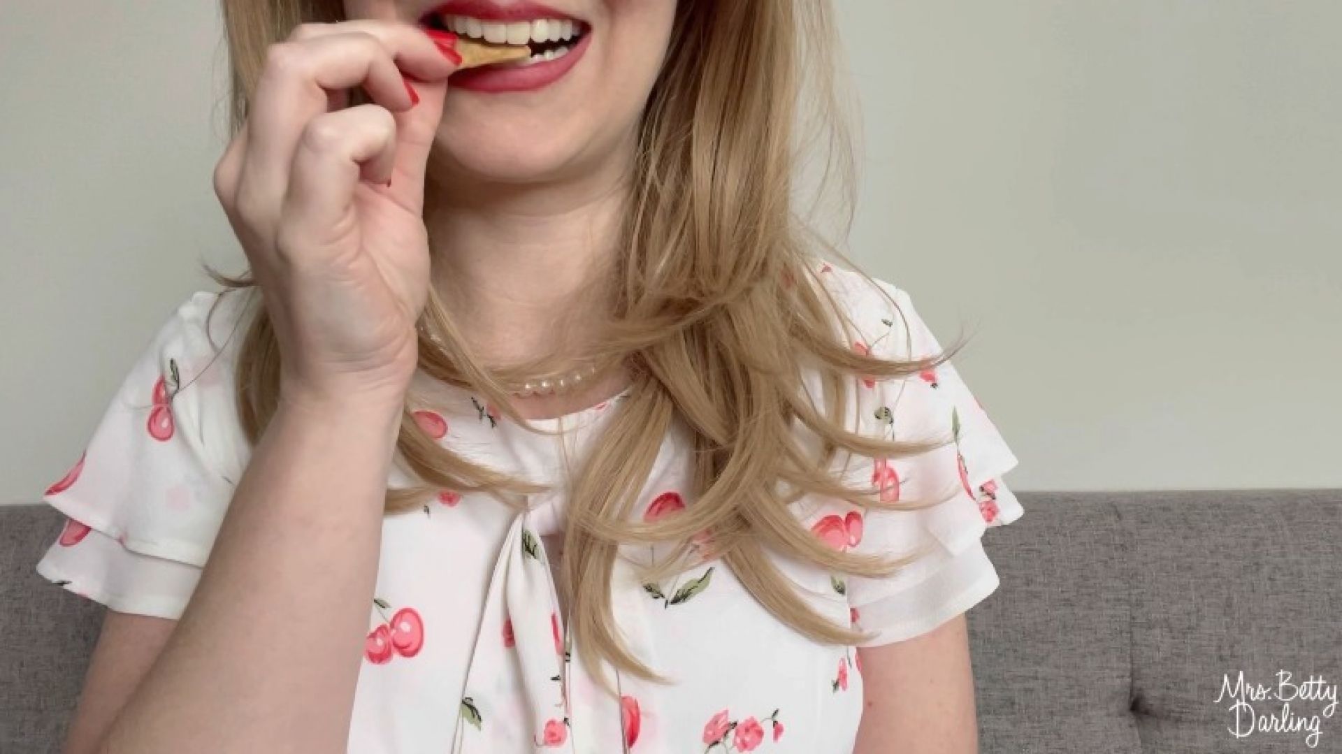 Proper Housewife Chews Crackers with Her Mouth Open