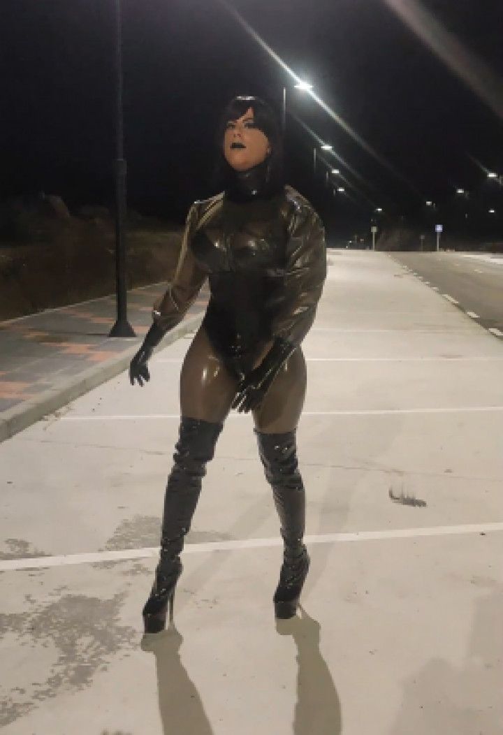 Dominatrix Tania in latex walking outdoor in public