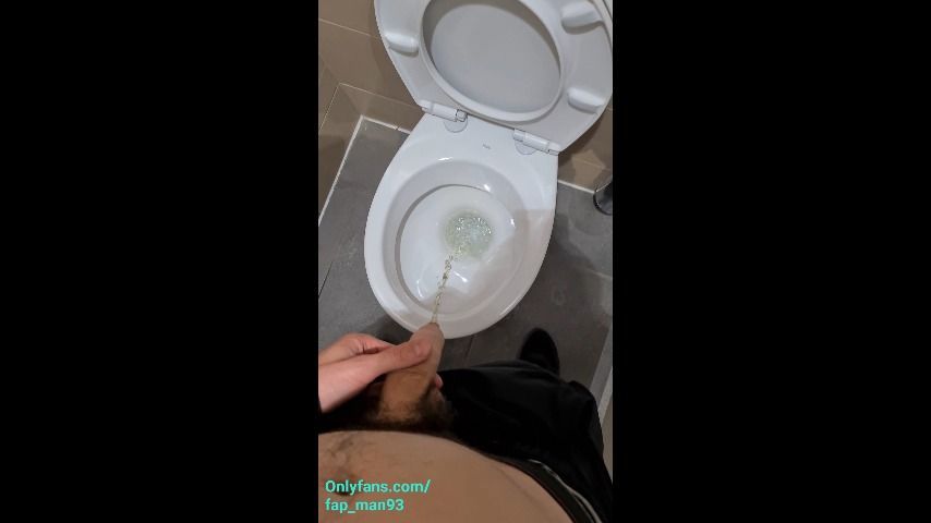 Man pissing in public toilets POV