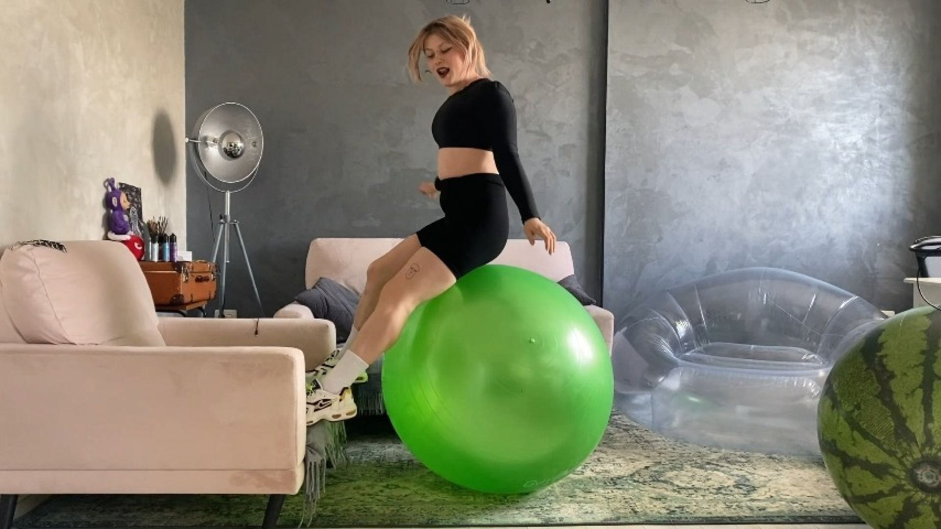 Sabina bounces between gym ball &amp; beach ball Jump to POP
