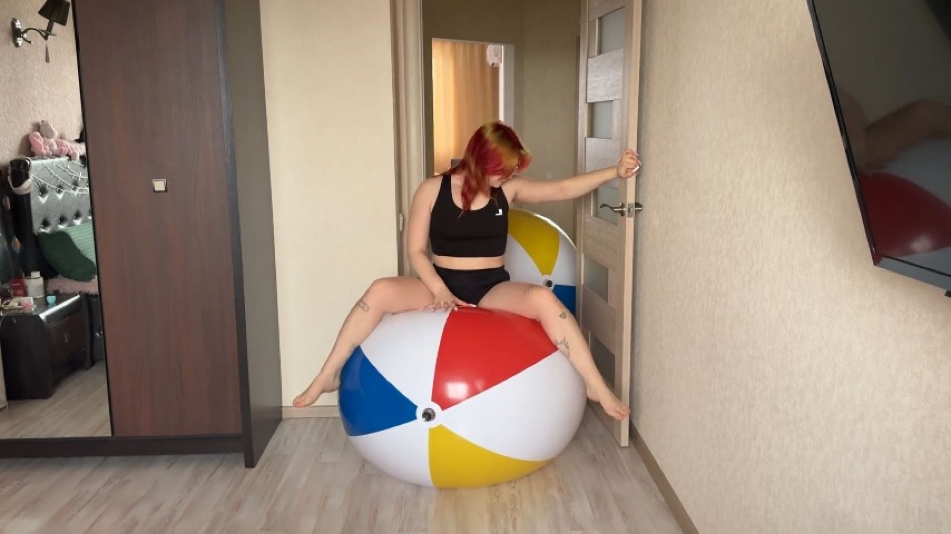 Sabina bounces two giant SHOSU beach balls in tight shorts