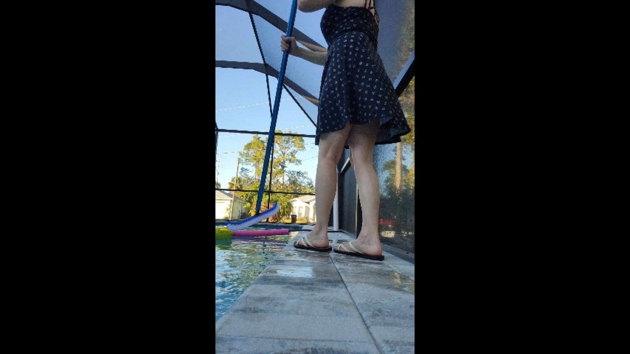 Watching Madre  Marie clean the pool