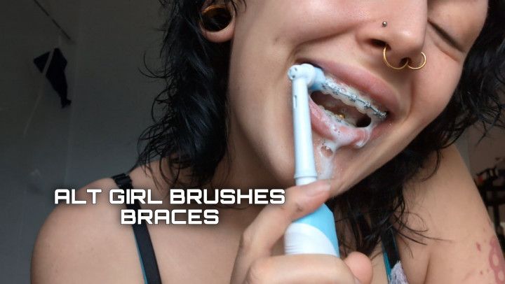 ALT GIRL BRUSHES TEETH AND BRACES