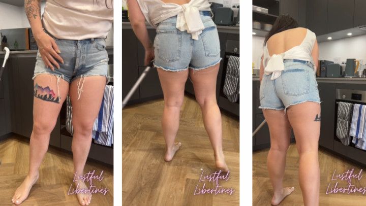 Nonchalant denim shorts wetting while mopping the floors