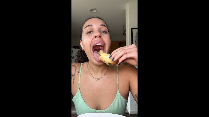 Sammie eats a messy sandwich