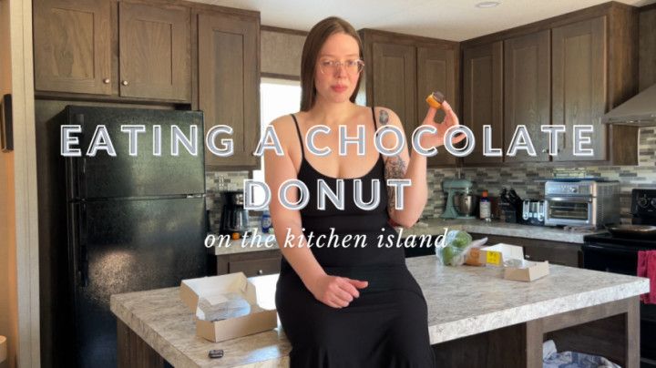 Eating a chocolate donut