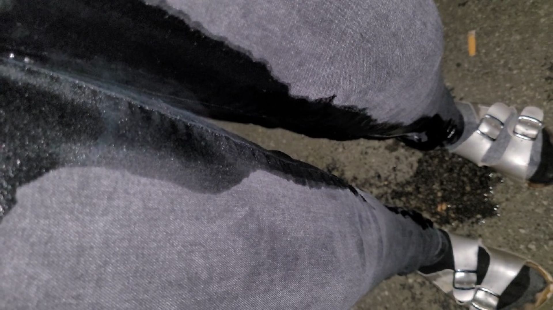a close up of thoroughly soaking my jeans in the parking lot