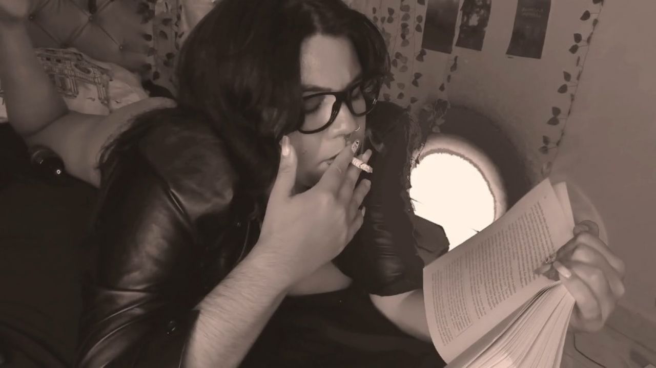 smoking, reading a book