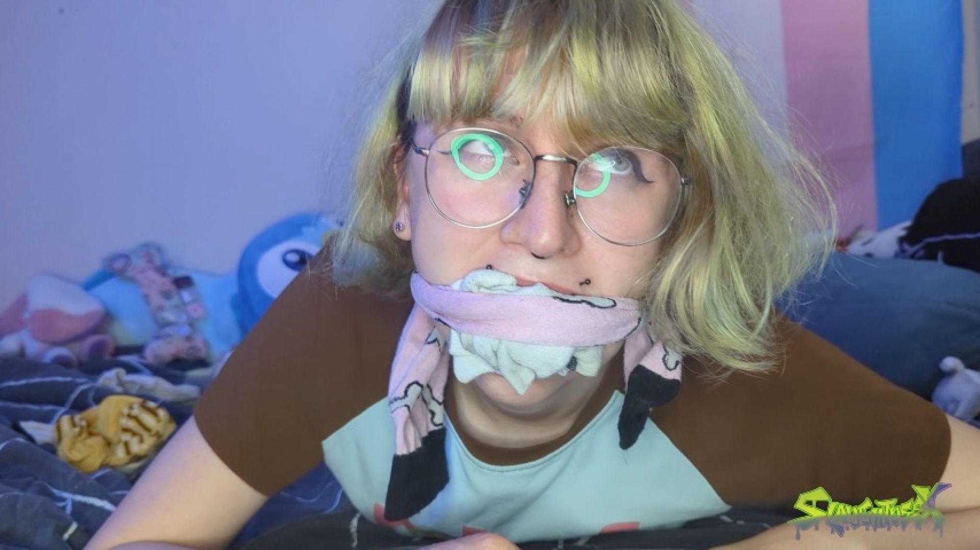 Gagslut stuffs socks in her mouth while taped up