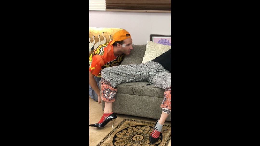 Guy Sneaking Around so He Can Sniff Woman