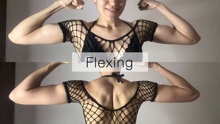 Sexy girl flexing muscles