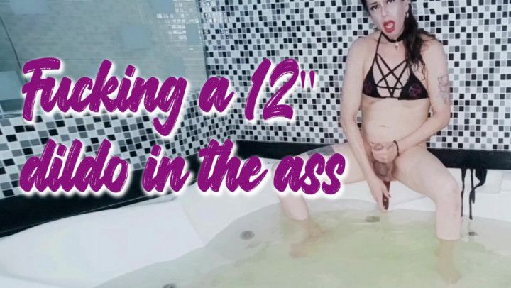 Trans takes a 12" dildo in her ass in a jacuzzi
