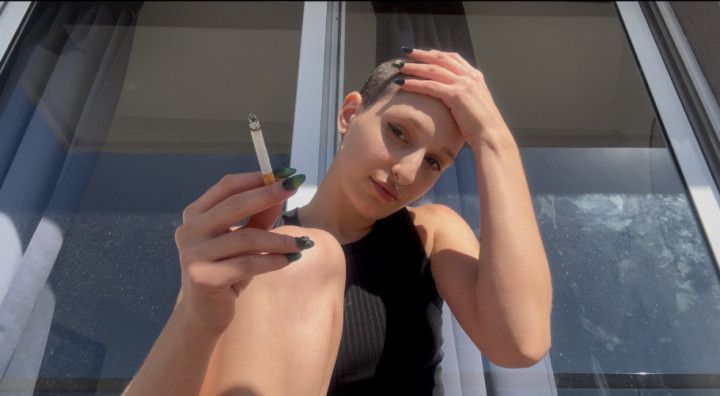 Smoking a cigarette in buzzcut