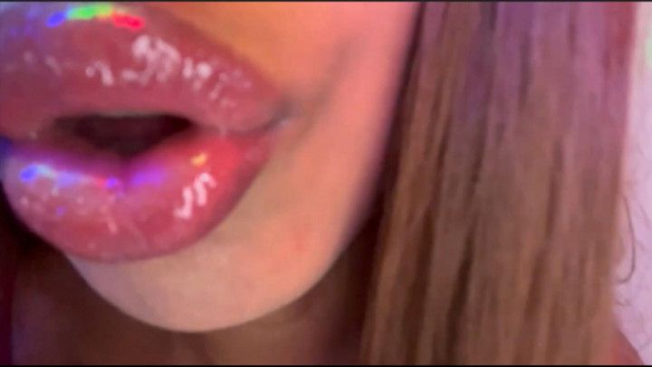 ASMR applying lip gloss and kissing