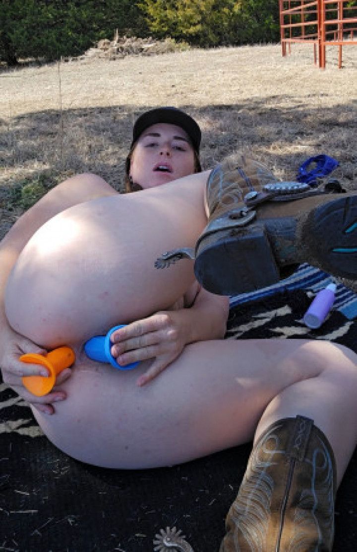 Redhead fucks ass and pussy using 2 dildos squirting outside