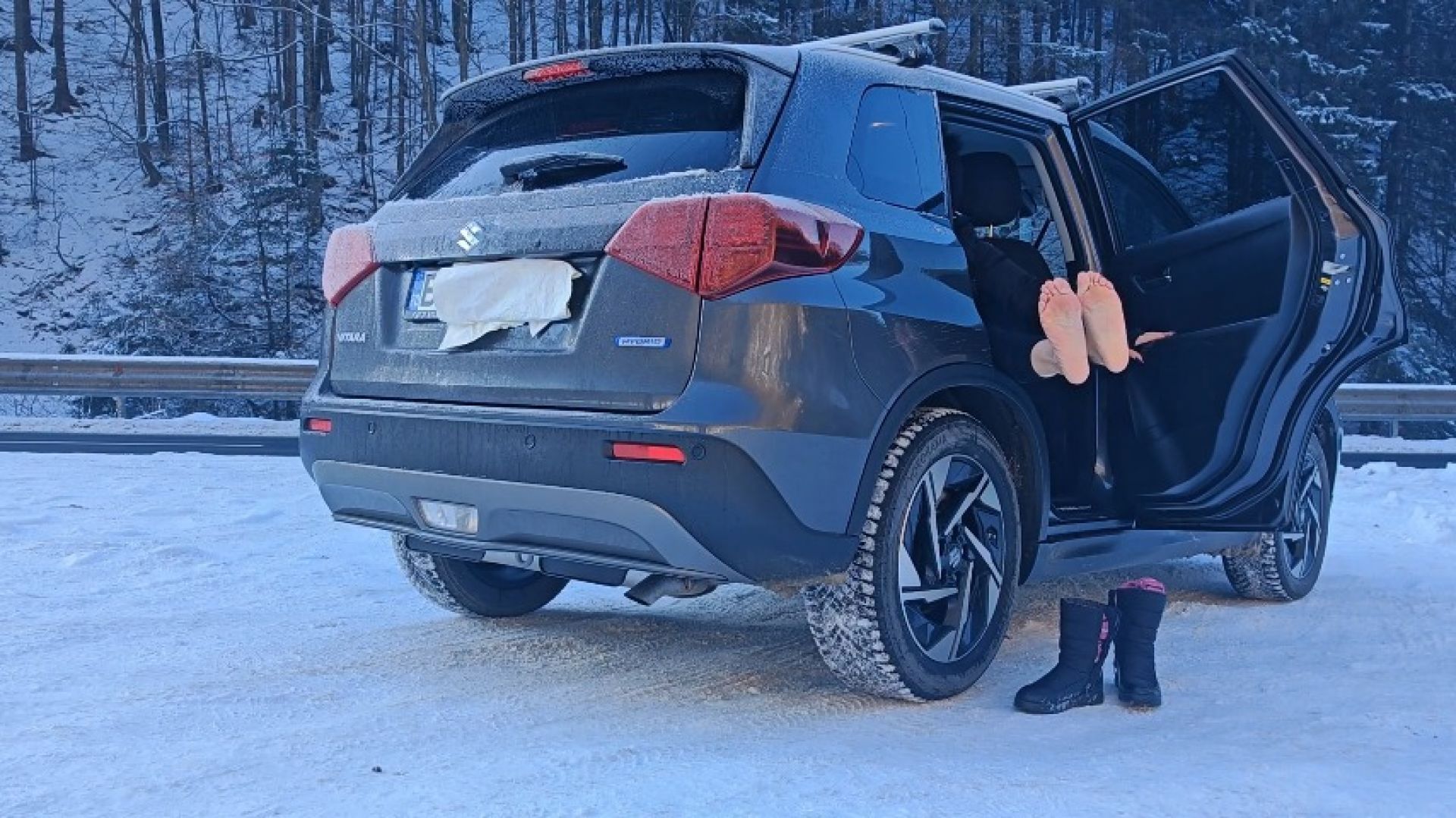 dancing with my friend in the car, making the car shake