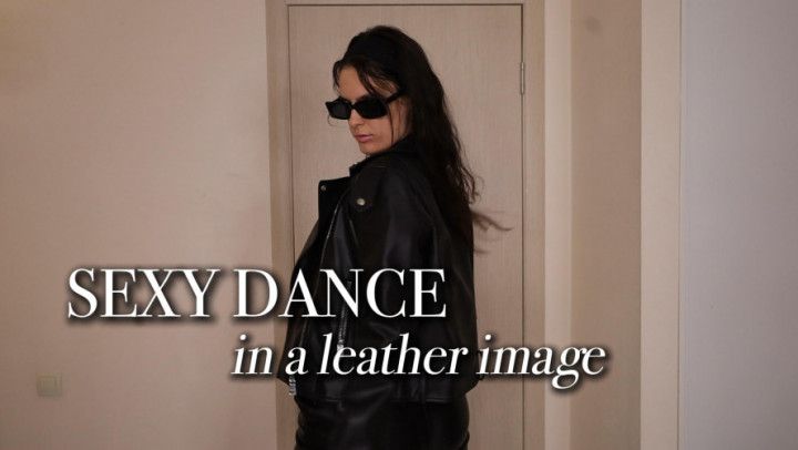Sexy dance from a hot girl in a leather jacket and pants