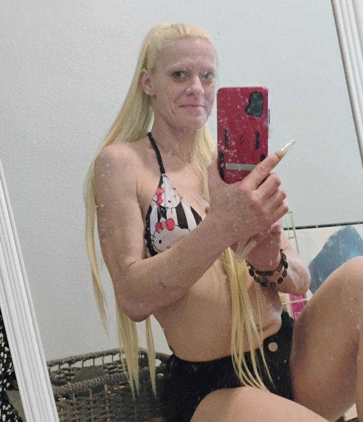 Beautiful petite blonde shows off her sexy bod n long hair