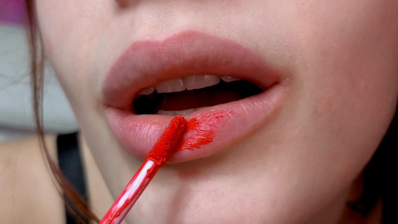 Red lipstick lip tease