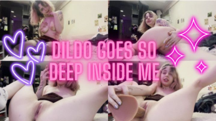 The dildo goes so deep inside me