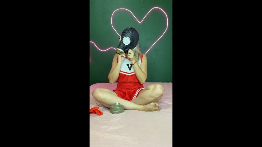 cheerleader in gas mask