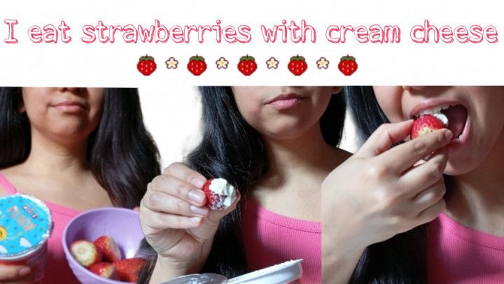 Eating strawberries with cream cheese