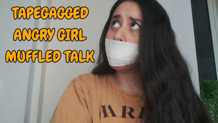 Self gagged girl muffled angry talking