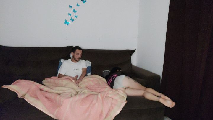 hot step-mother shares sofa with step-son while husband is tra